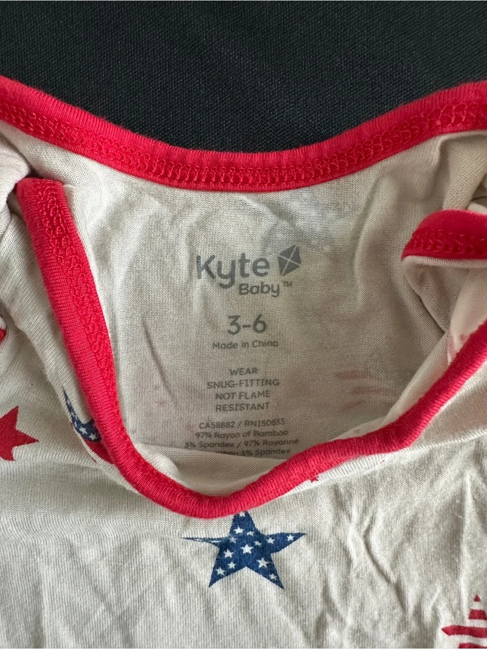 Kyte BABY White Onesie with Red Trim and Blue & Red Star Print